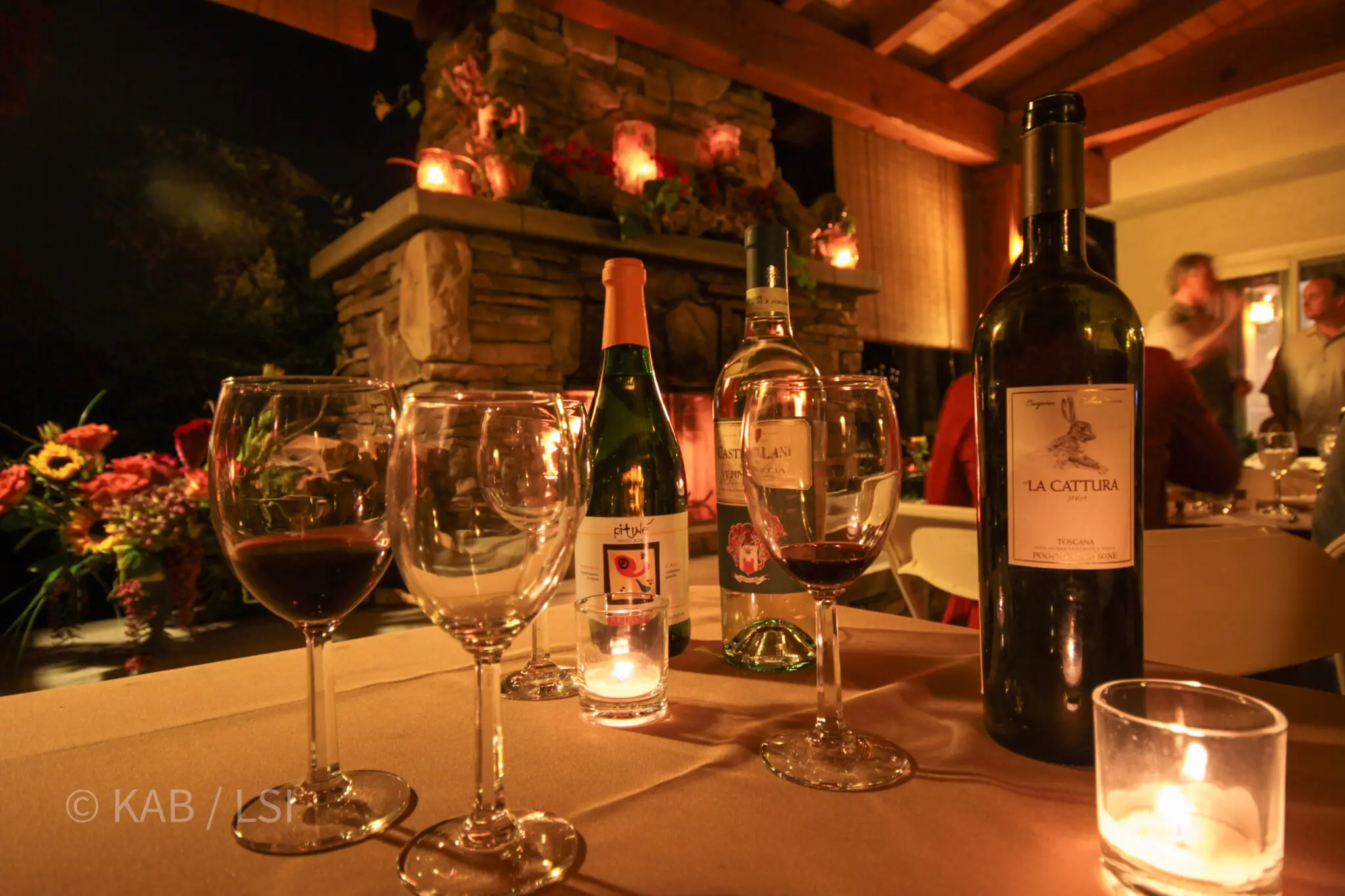 An outdoor evening wine tasting under string lights on a La Habra Heights hillside property