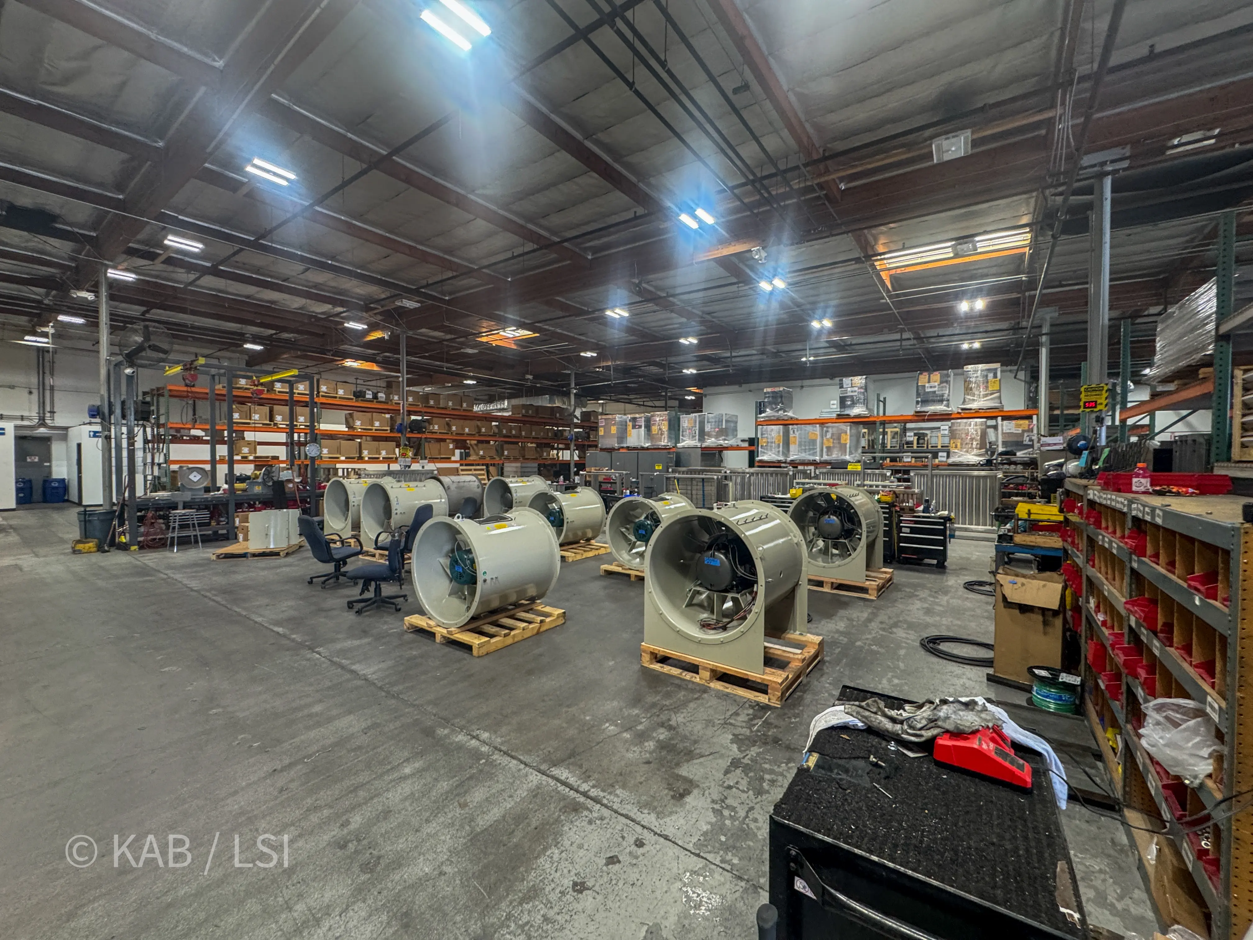 Tube-axial industrial fans staged on pallets on the ToroAire assembly floor at 1110 W. Taft Ave., Orange, CA.