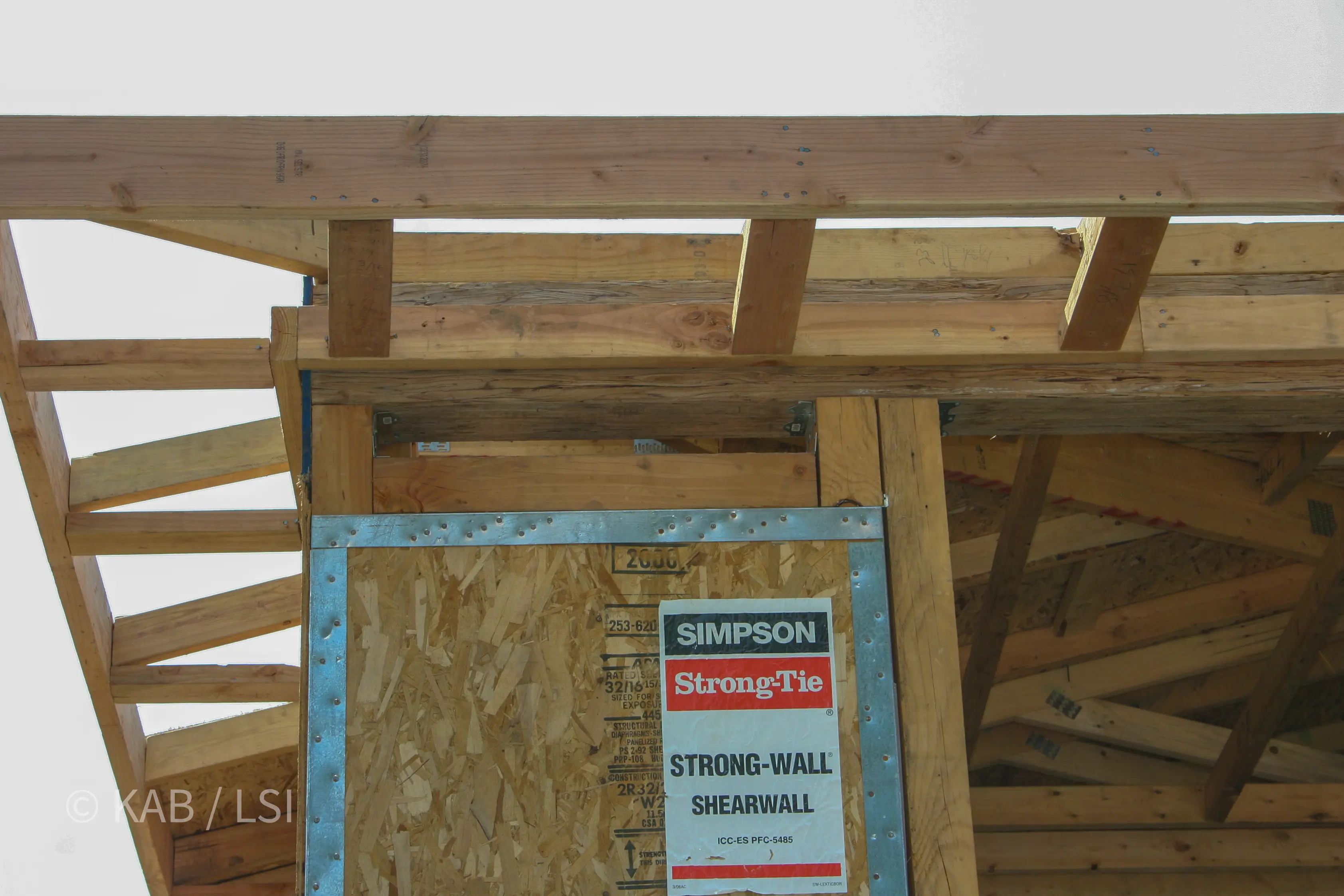 Simpson Strong-Wall shearwall product label — the engineered hardware behind a 60-foot-deep garage © KAB/LSI