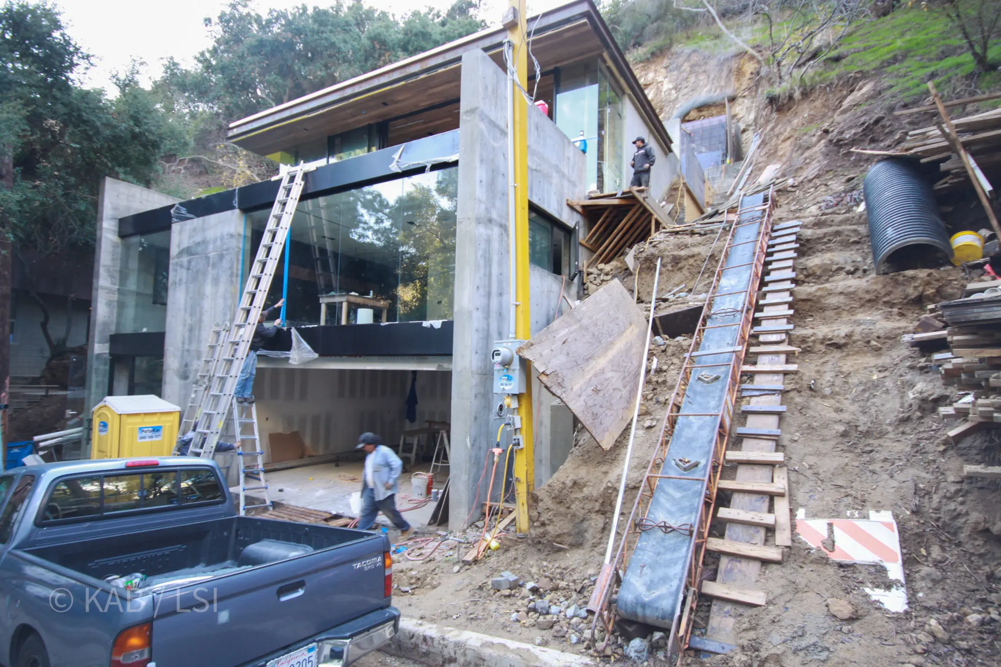 Conveyor system carrying excavated rock and soil down from a hillside building site to the street below in Beverly Hills
