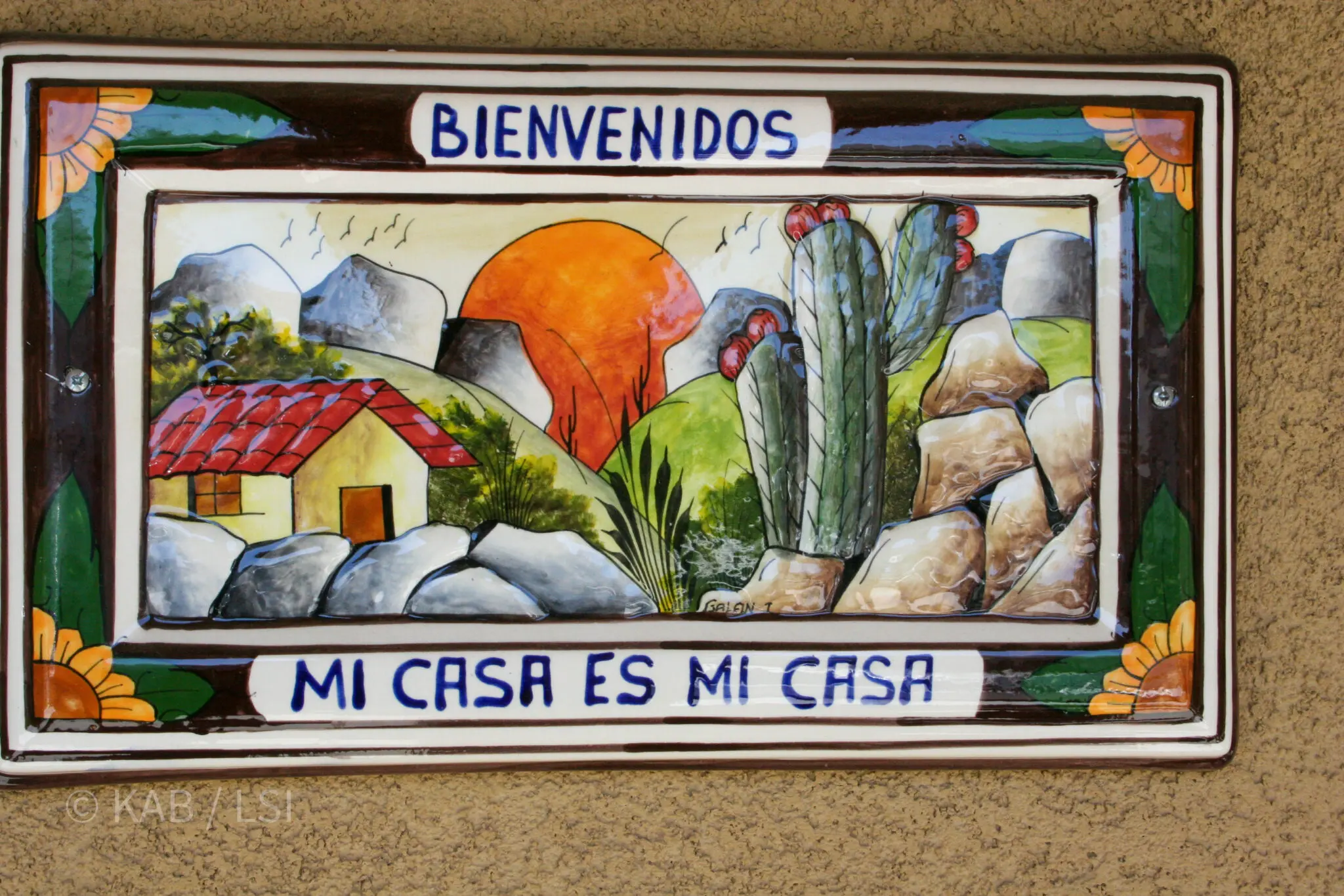 Hand-painted Bienvenidos tile mural reading Mi Casa Es Mi Casa on a La Habra Heights property entrance