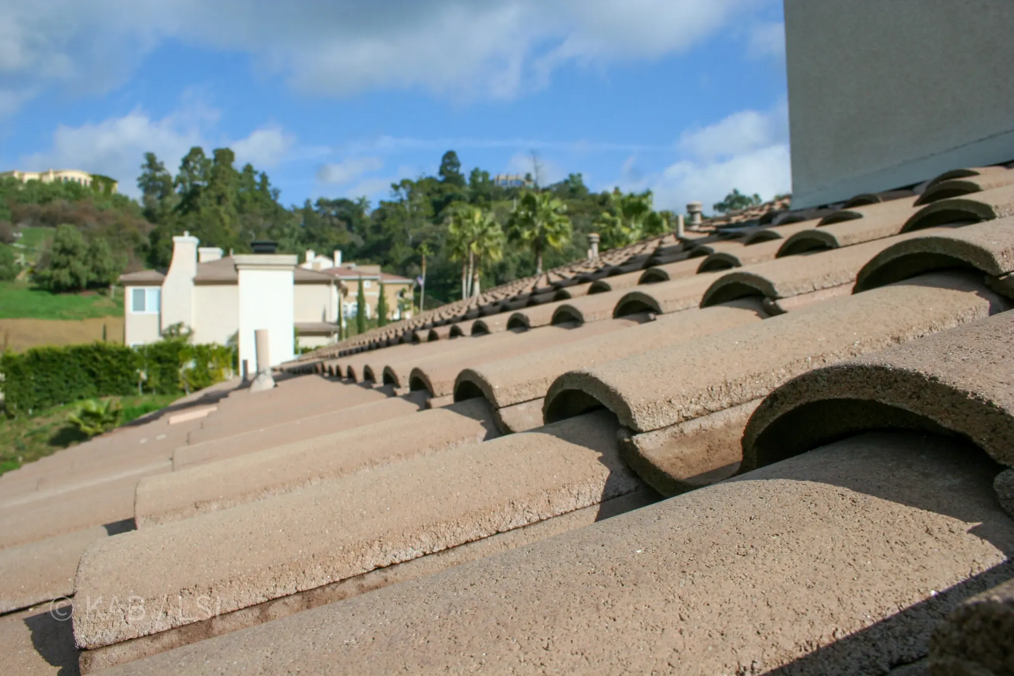 Fire-resistant concrete tile roof on a La Habra Heights hillside home — the specialty that became a 20-year practice © KAB/LSI
