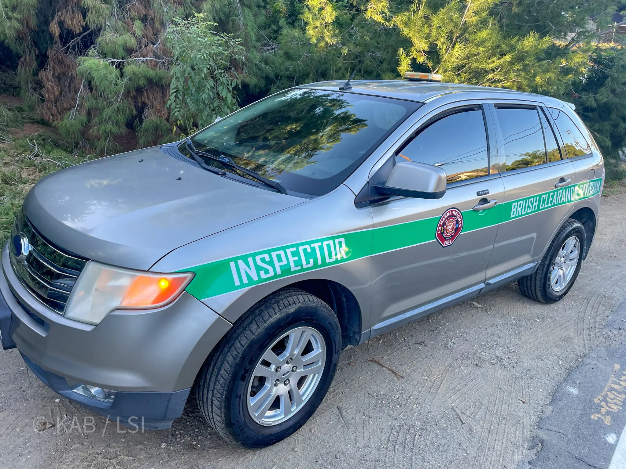 The La Habra Heights brush clearance inspector vehicle on a hillside road