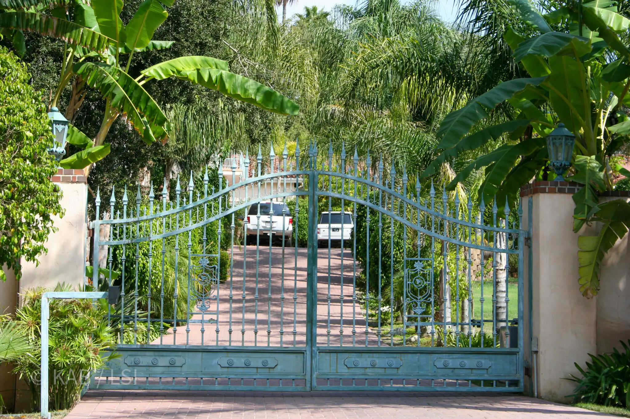 Entry gate — La Habra Heights hillside property. A coded gate with clear driveway clearances gives Cal Fire a staging point.