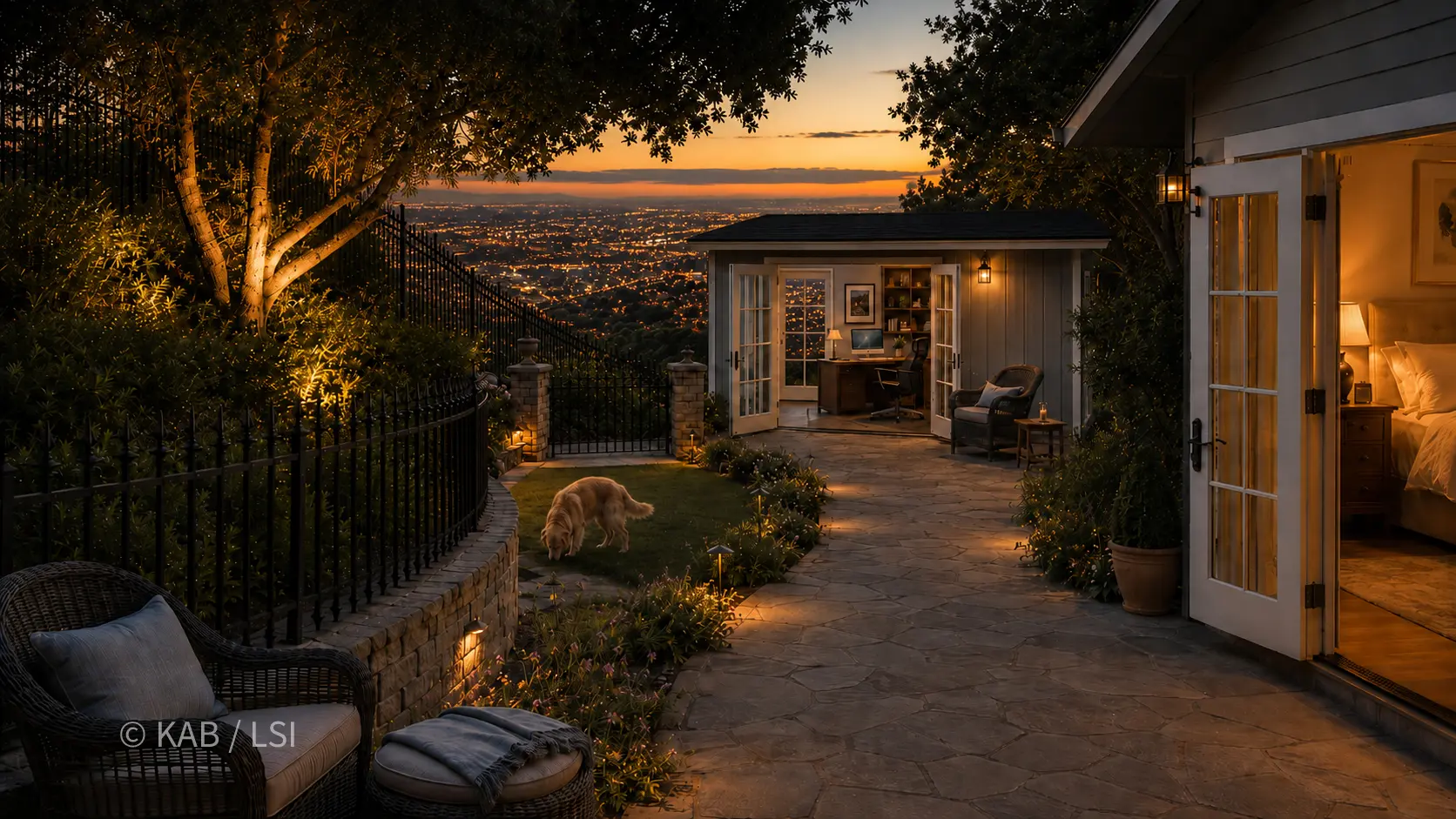 An artist's illustration of a detached home office built as a private-space push-out from a hillside master suite — French doors open at dusk, a dog on the lit lawn, the master bedroom glowing alongside, the city lights below.