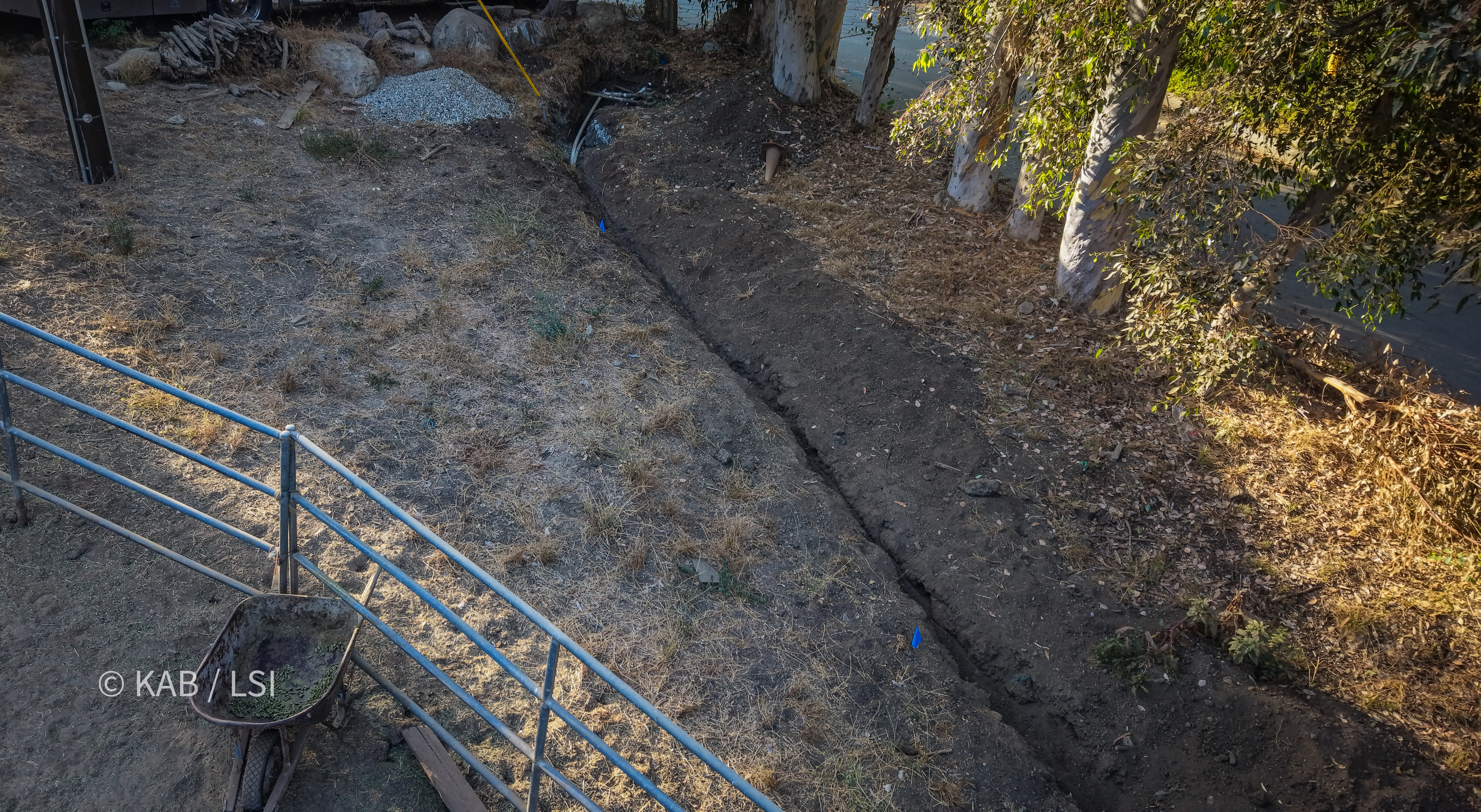 Aerial view of hillside buildings at the top of a long water service run on a hillside property in La Habra Heights