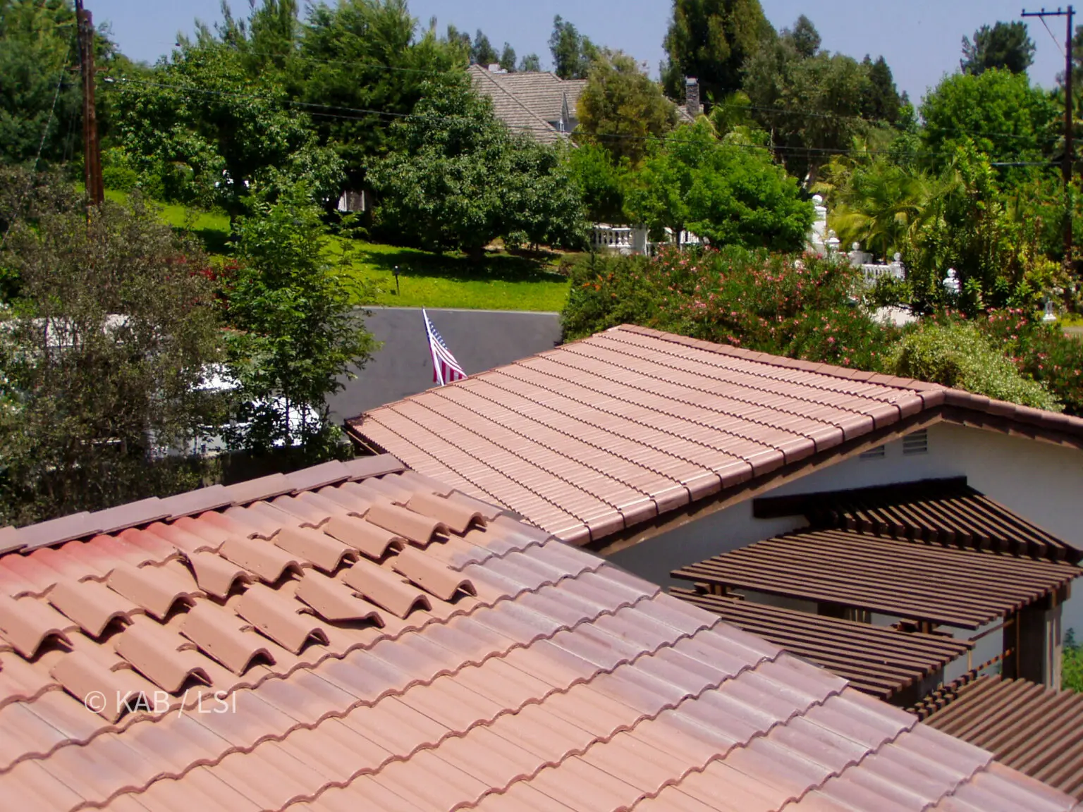 Restored concrete tile roof on a La Habra Heights home after repair and cleaning, indistinguishable from new