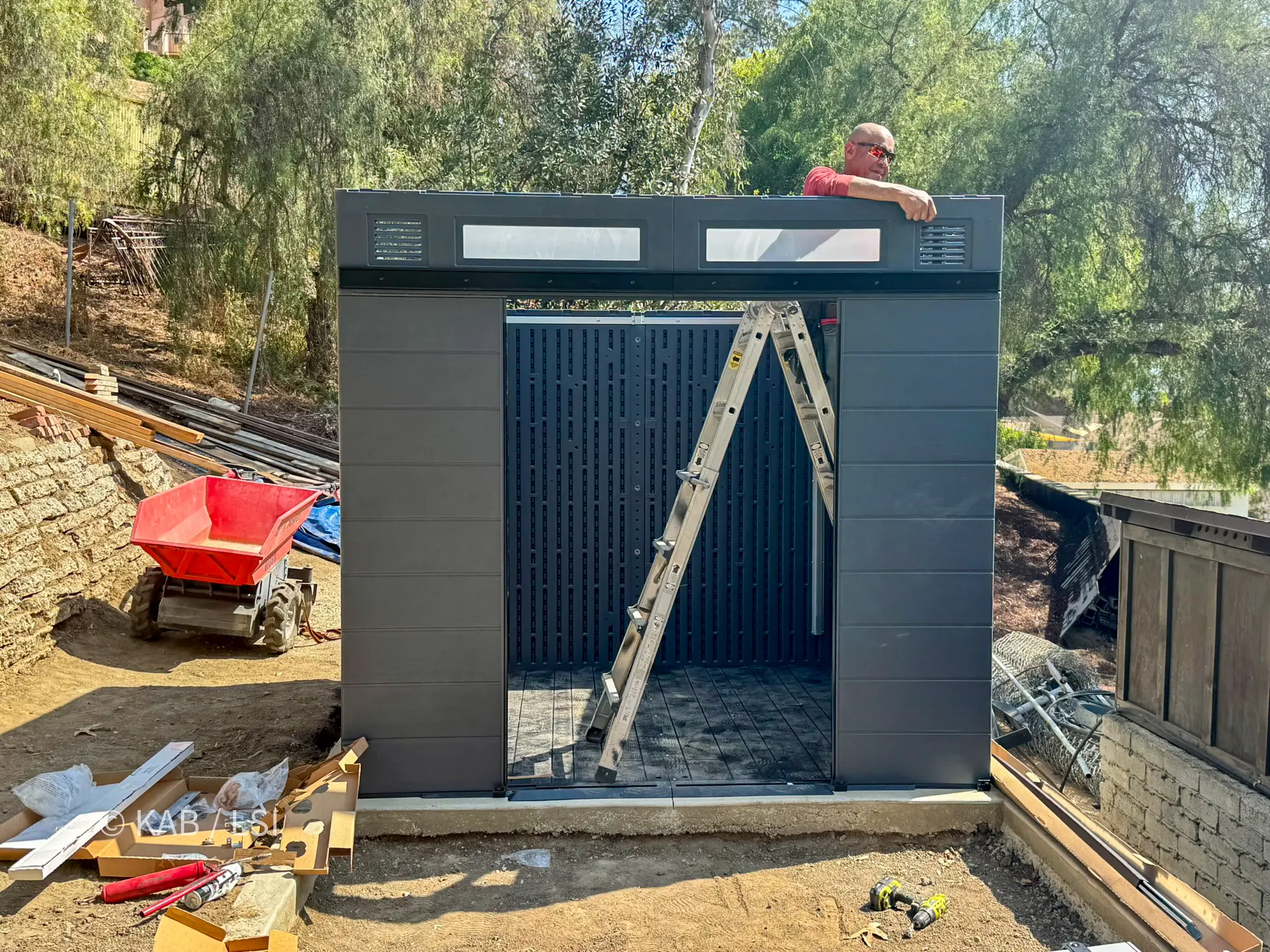 Lifetime storage shed structure completed before roof and door installation