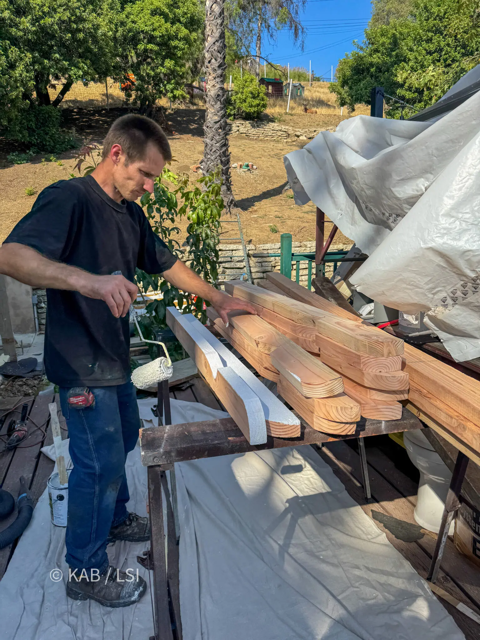 New rafter tails installed and the stucco wall closed around them on a hillside home