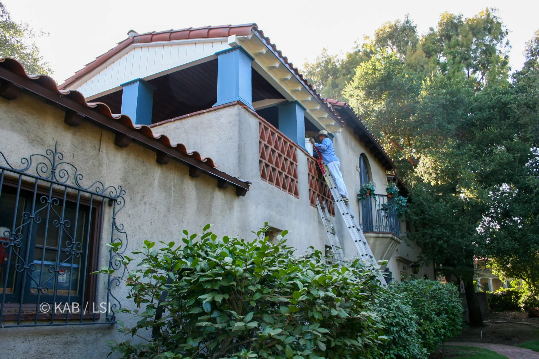 Rebuilt rafter tails, corbels and gable end on the loggia of a 1920s house, finished and painted under a clay tile roof