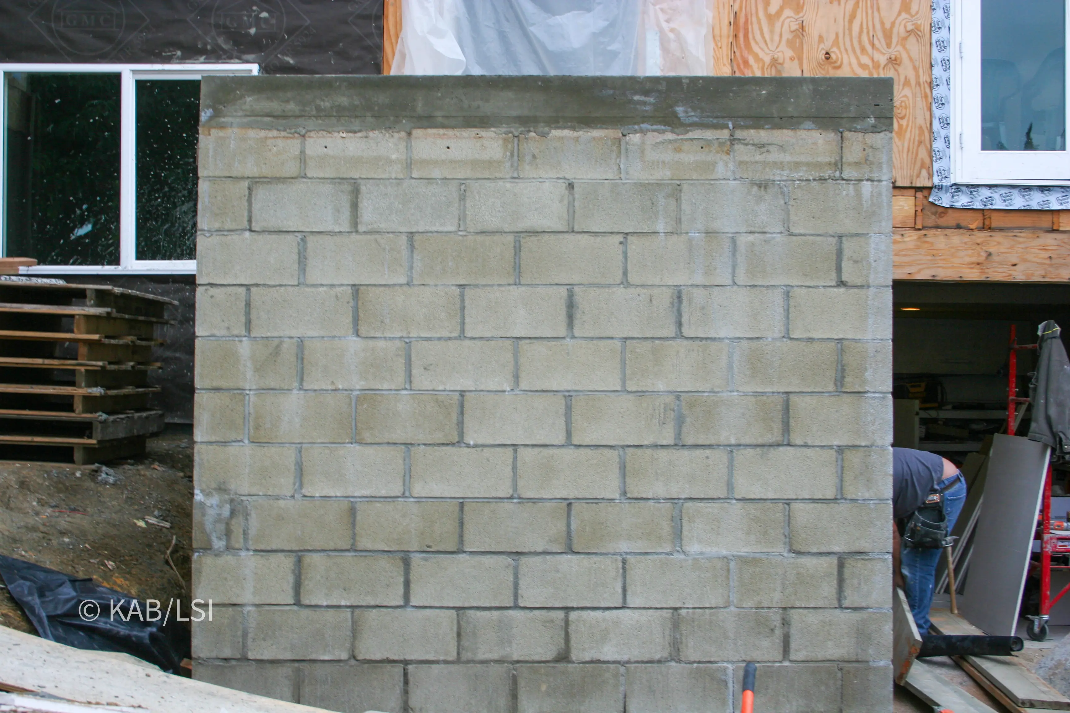 Completed reinforced concrete roof on a hillside safe room with the forms stripped away