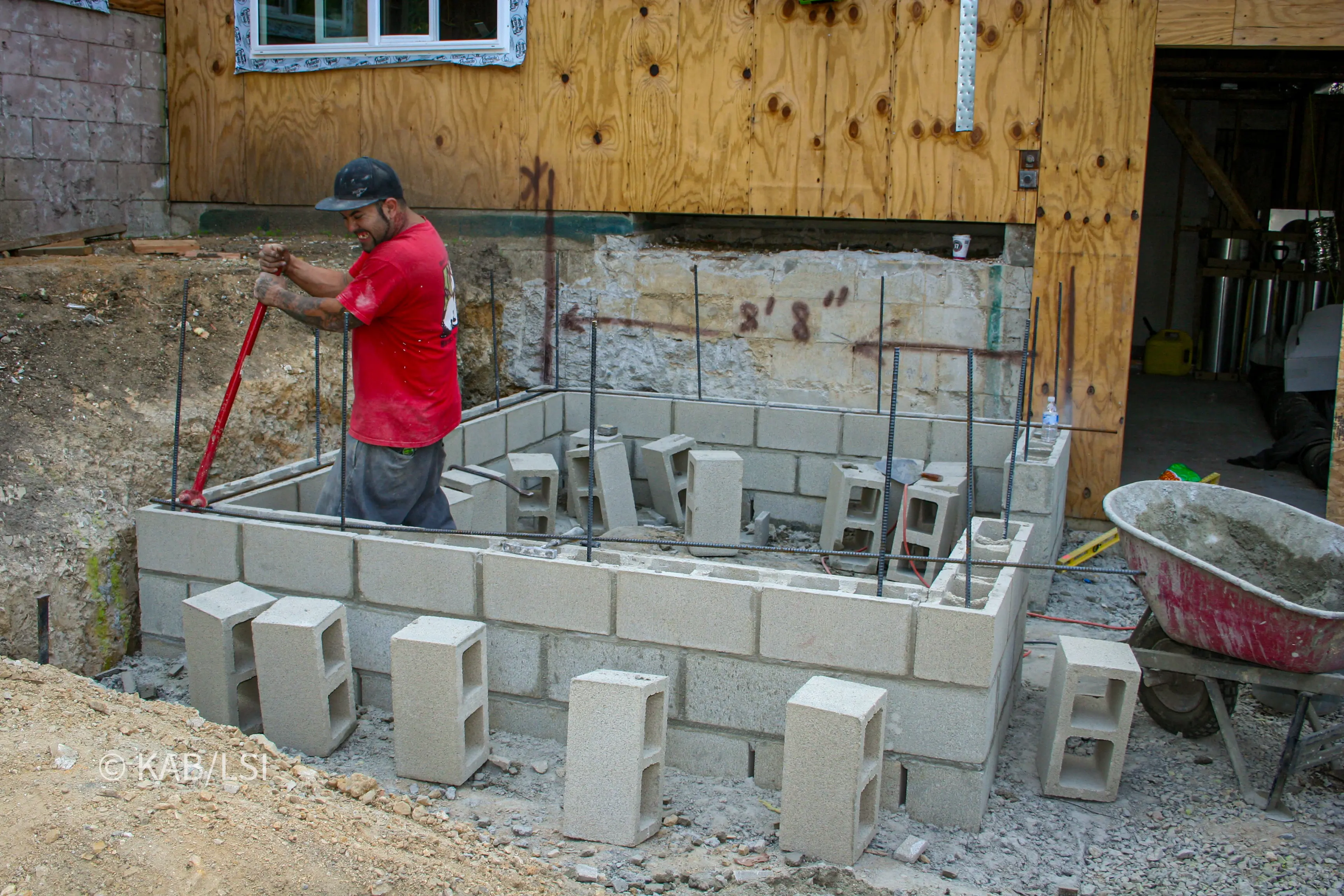 Excavation and reinforced footing at the start of construction of a concrete safe room on a hillside property in La Habra Heights