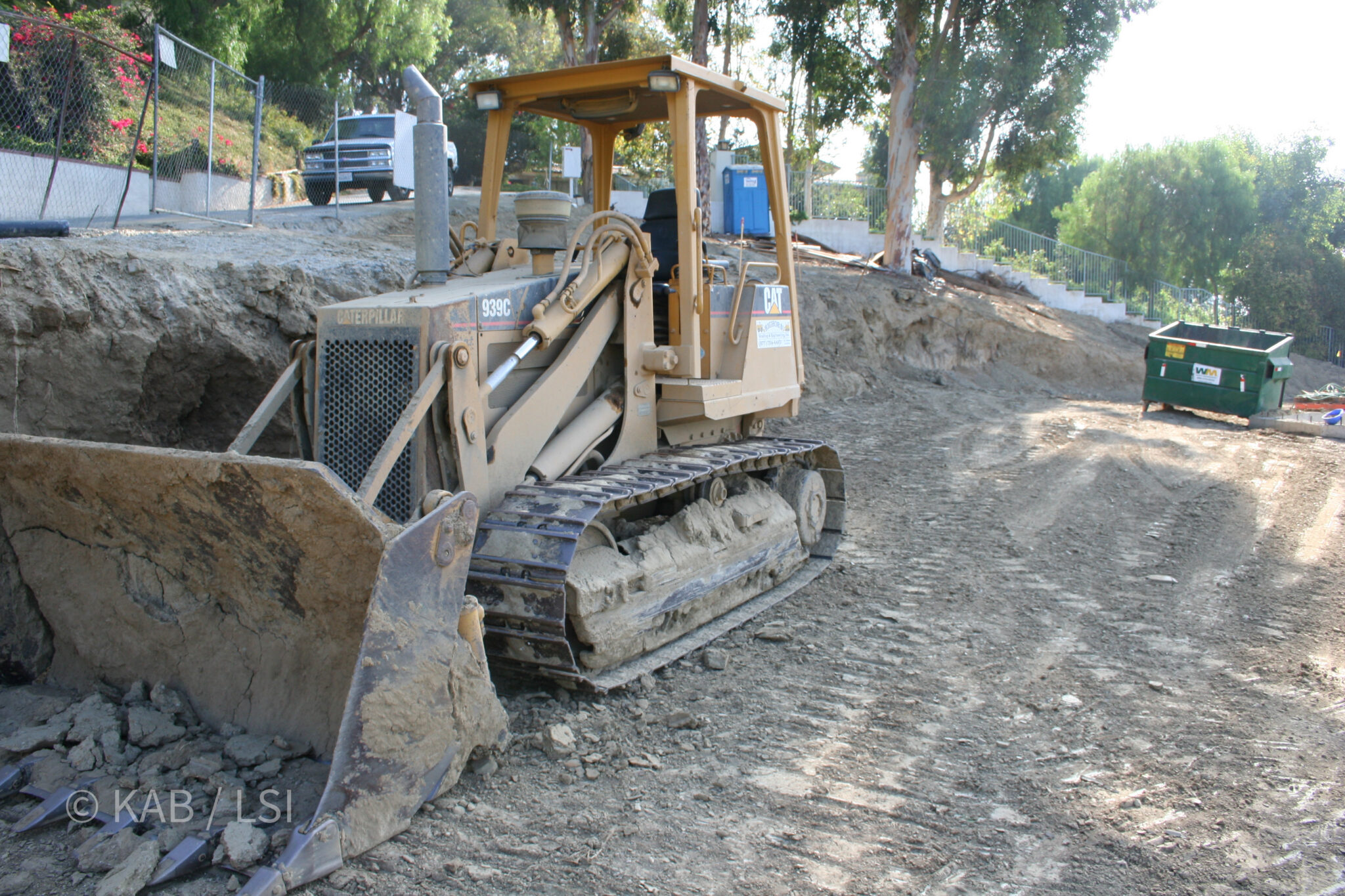 CAT 939C tracked loader grading hillside lot for concrete pad — La Habra Heights
