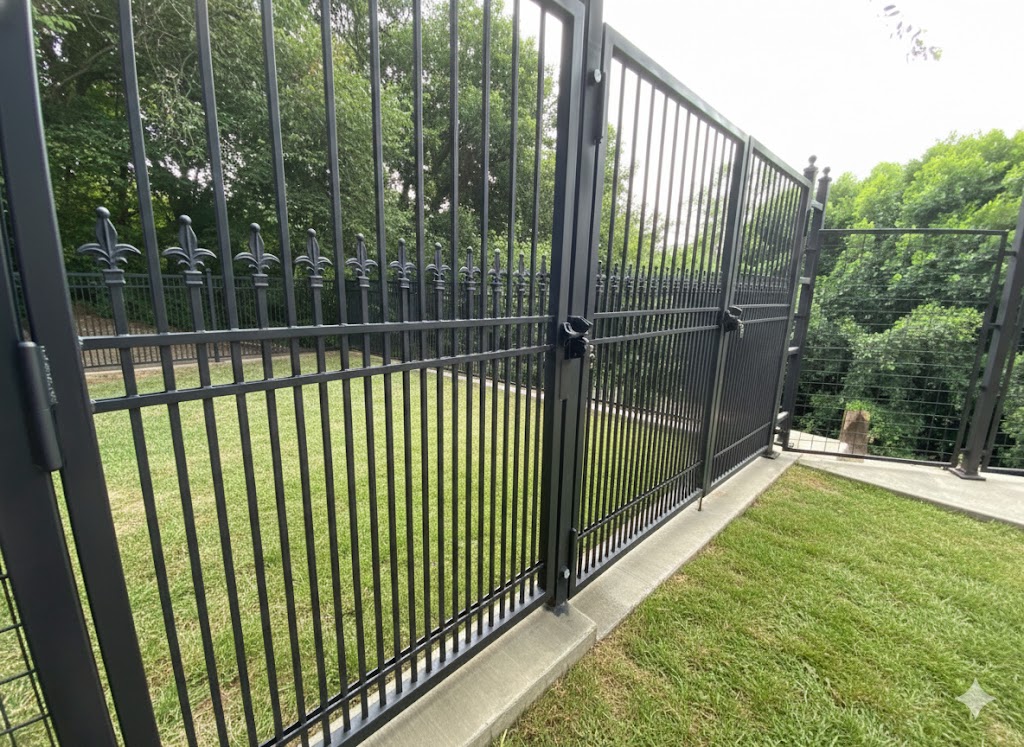 Black ornamental wrought iron coyote-resistant fence and gate La Habra Heights CA hillside property security